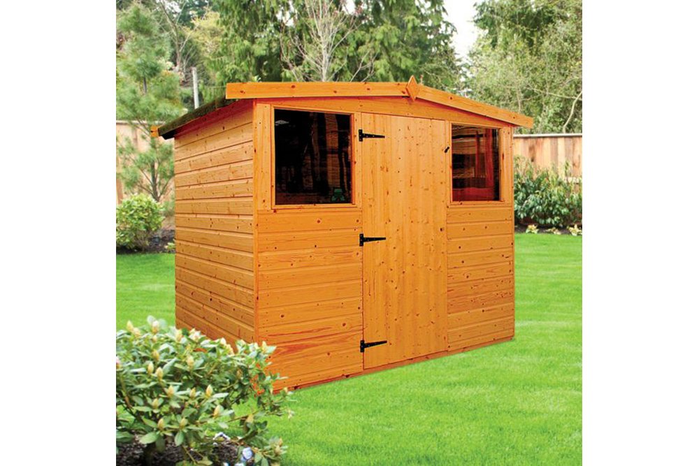 a wooden shed in a garden