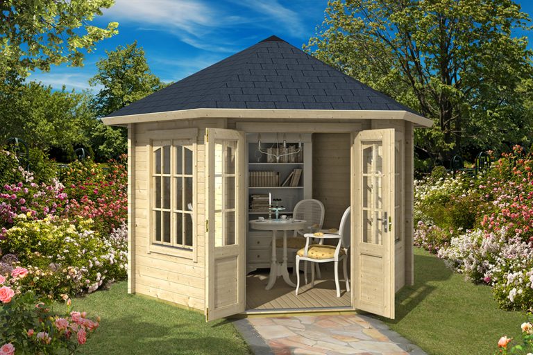 an octagonal summerhouse with a table and chairs in a garden