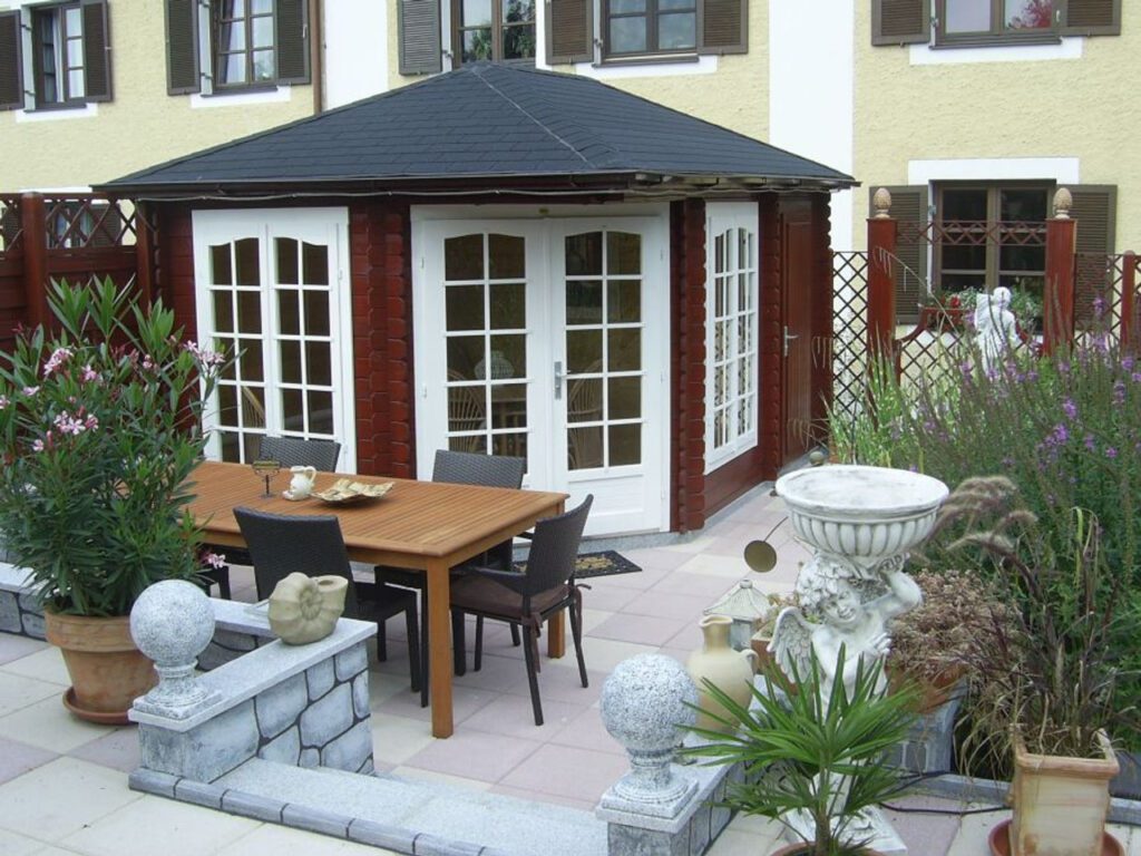 Melanie 4 Log Cabin with glazed summerhouse and side storage room, corner garden building