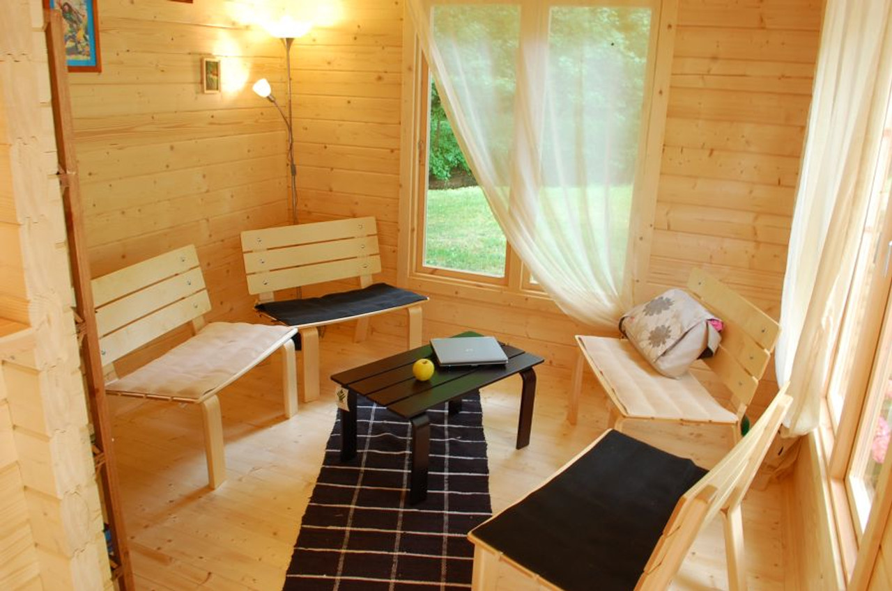 Anna 1 Log Cabin with cross-shaped layout, French doors, and multi-room design, perfect for offices or studio use