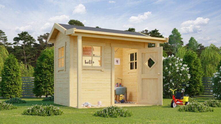 A small wooden shed with a grey roof and open door sits in a garden with a tricycle and toys nearby on a sunny day